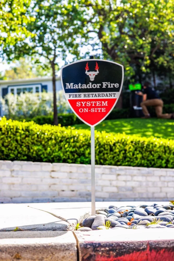 Matador Fire wildfire defense system on-site sign at a home